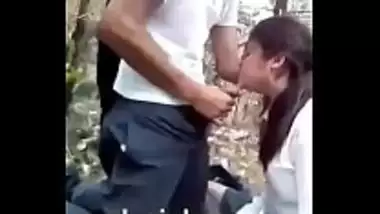 Desi school girl blowjob in the middle of the jungle